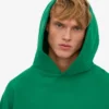 Ekologisk oversized-huva – kellygrön