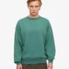 Ekologisk oversized-tröja med rund hals – tallgrön