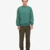Ekologisk oversized-tröja med rund hals – tallgrön