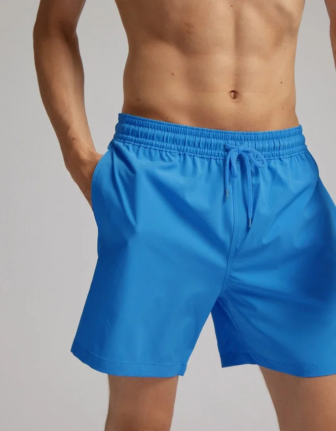 Klassiska badshorts – ljus korall