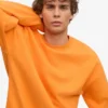 Överdimensionerad ekologisk tröja – solig orange