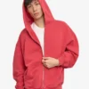 Överdimensionerad hoodie i ekologiskt tyg med dragkedja – blekt rött